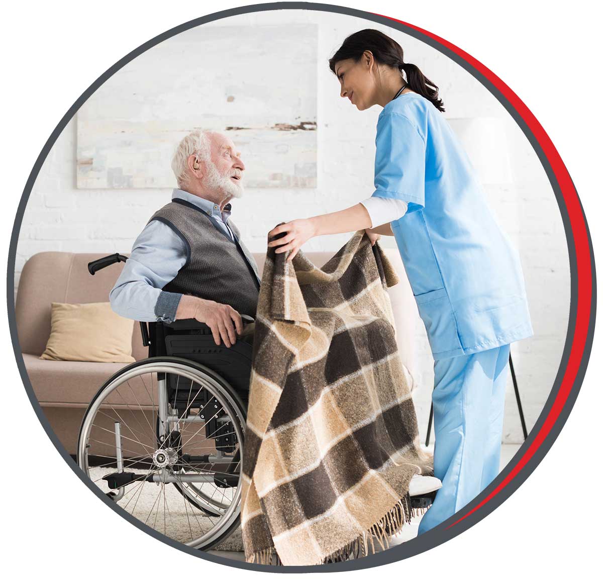 KanCover home care aide helping elderly man in wheelchair with a blanket, part of compassionate non-medical personal care services delivered in Saline County and North Central Kansas.