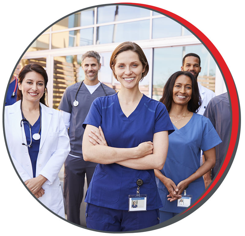 Smiling medical professionals standing together in a circle frame